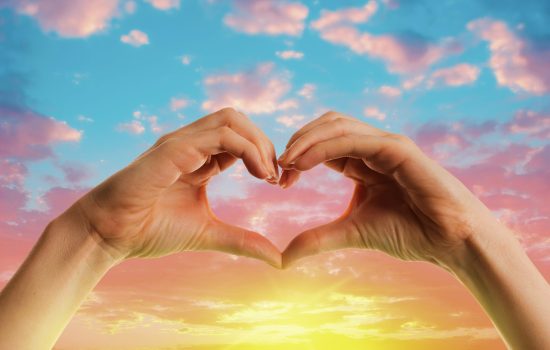 heart-shaped-hands-sunset